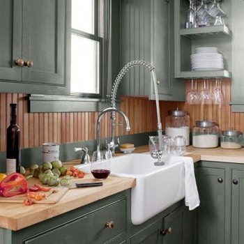 gray cabinets with brown beadboard backsplash and butcherblock countertop