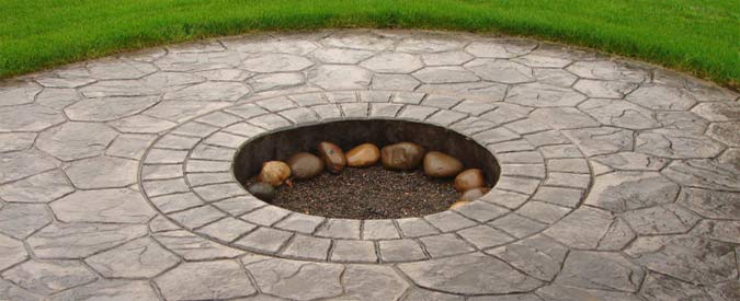Silver stamped concrete patio area with Fire Pit