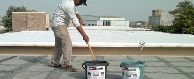 Man Sealing a Flat Roof